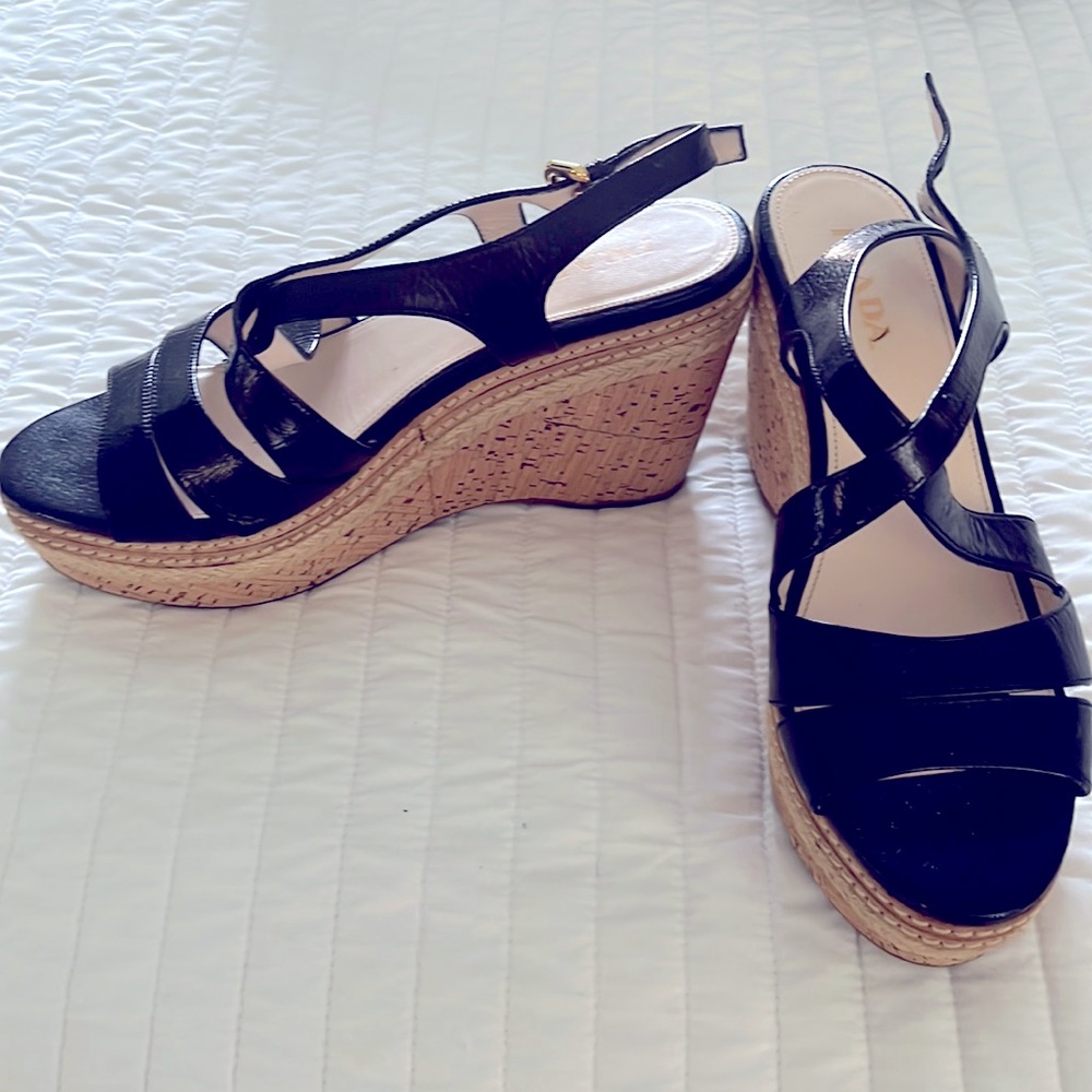Like new condition.  Black leather; wedge sandal.  Gold buckle.